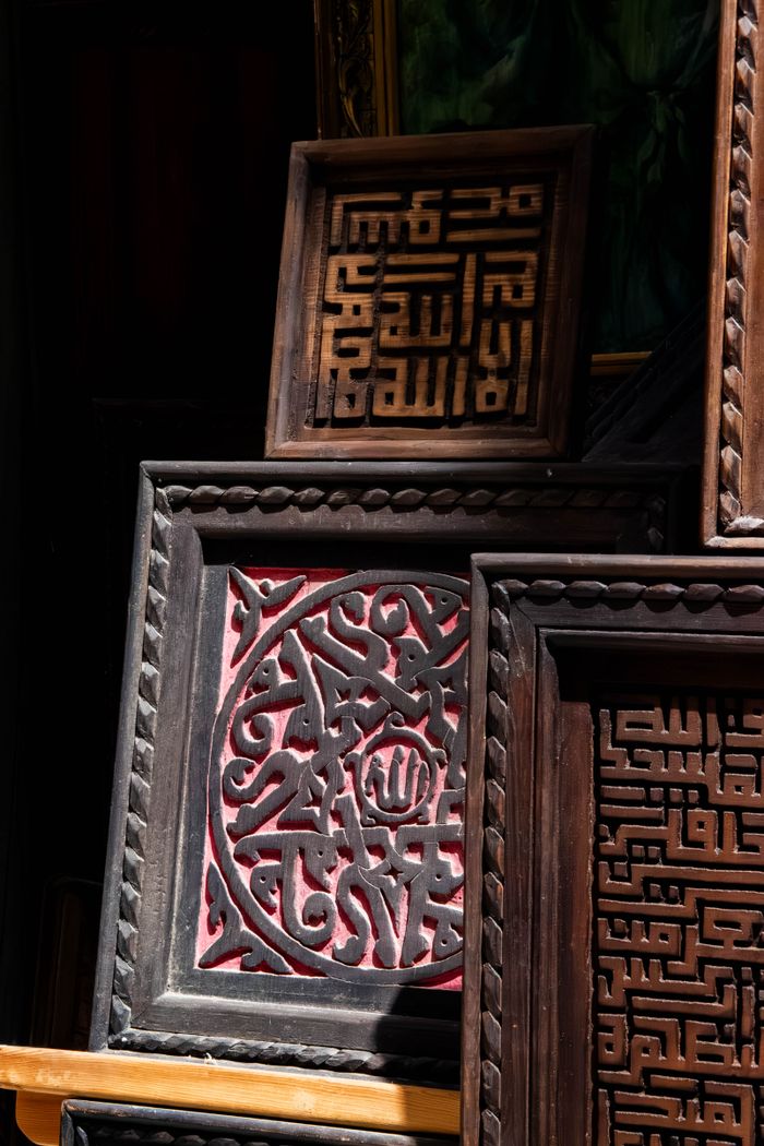 services-03 Detailed wooden panels featuring Arabic calligraphy showcasing traditional Moroccan craftsmanship.